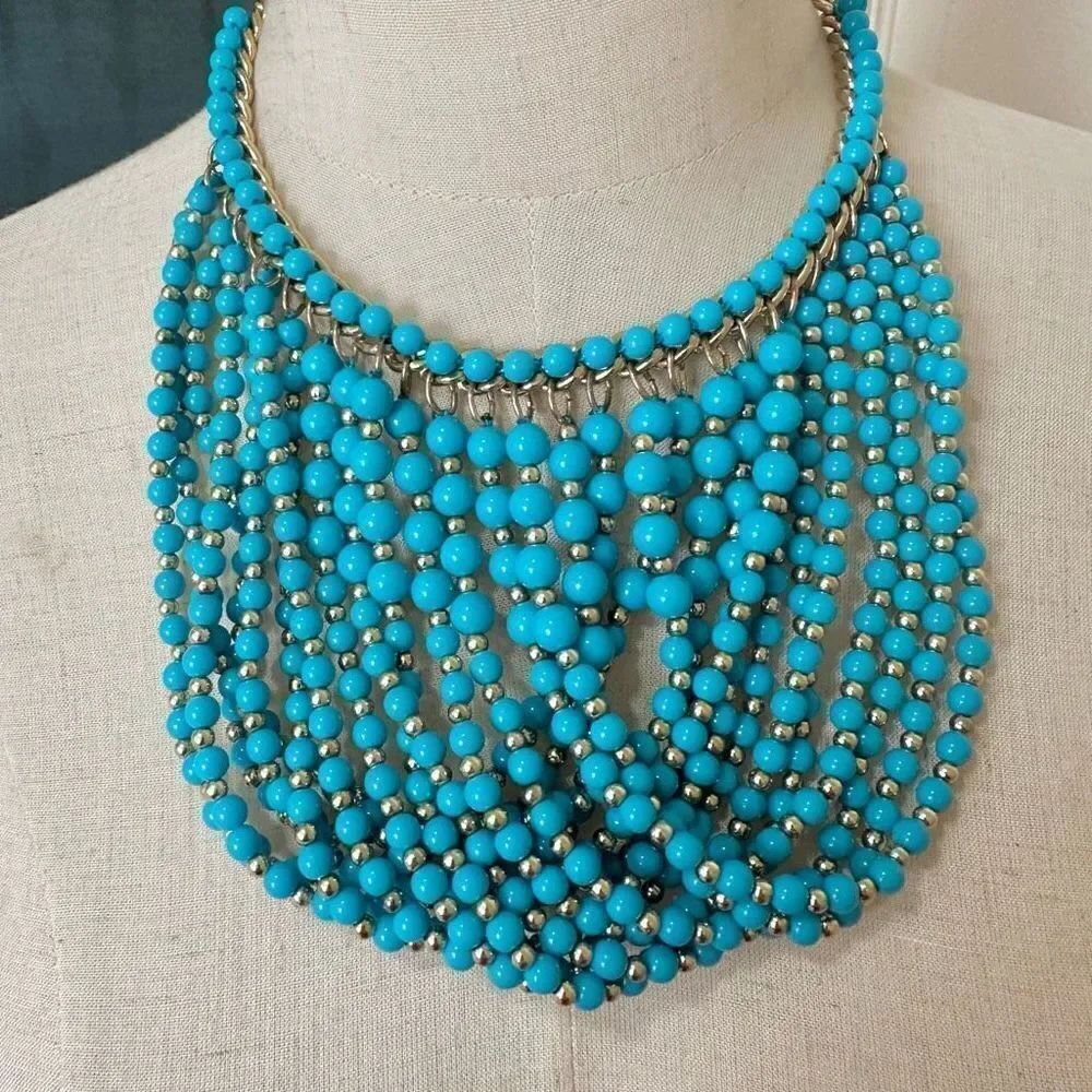 Turquoise blue and gold tone beaded statement necklace
